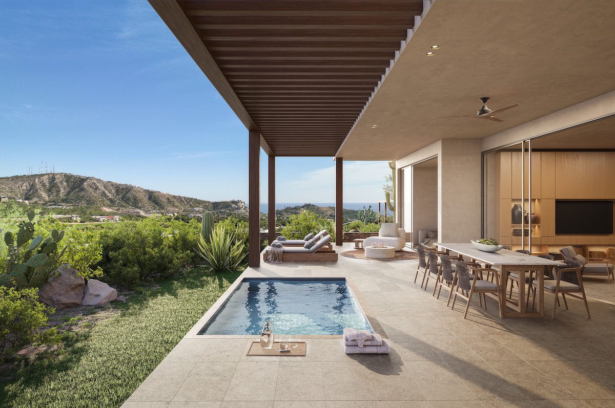 Covered outdoor terrace at a Mountain Residences home featuring a dining area, lounge seating, and a private plunge pool, surrounded by desert landscaping with cacti and overlooking rolling hills and distant ocean views.