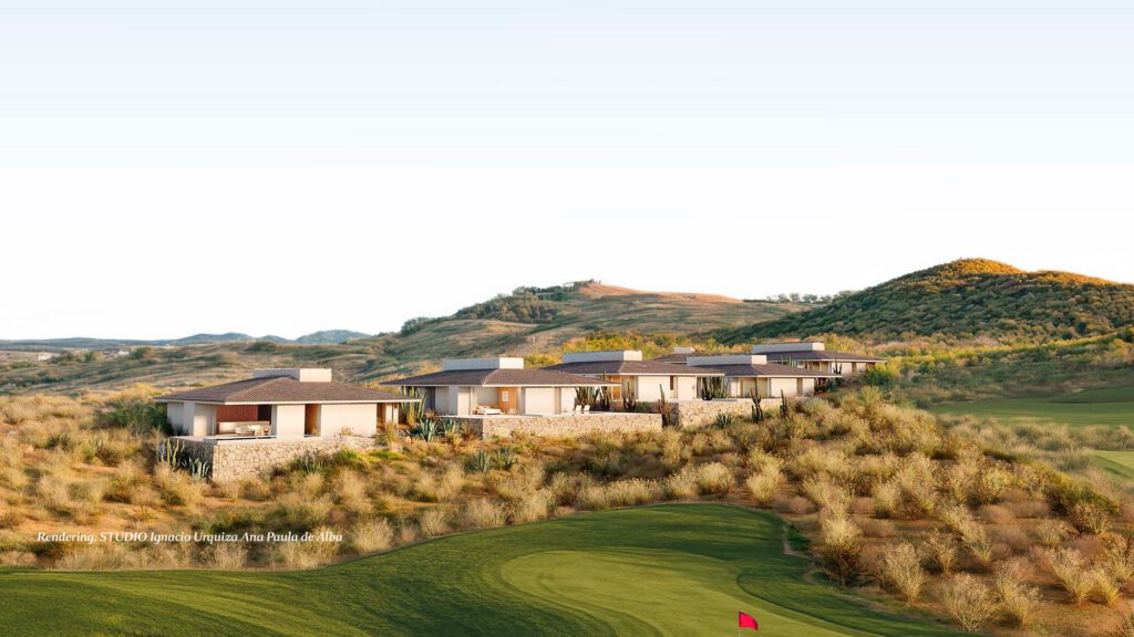 Row of contemporary Valley Estate homes set along a desert hillside, featuring stone and stucco architecture surrounded by native vegetation, overlooking a green golf fairway with rolling mountains in the background at golden hour.